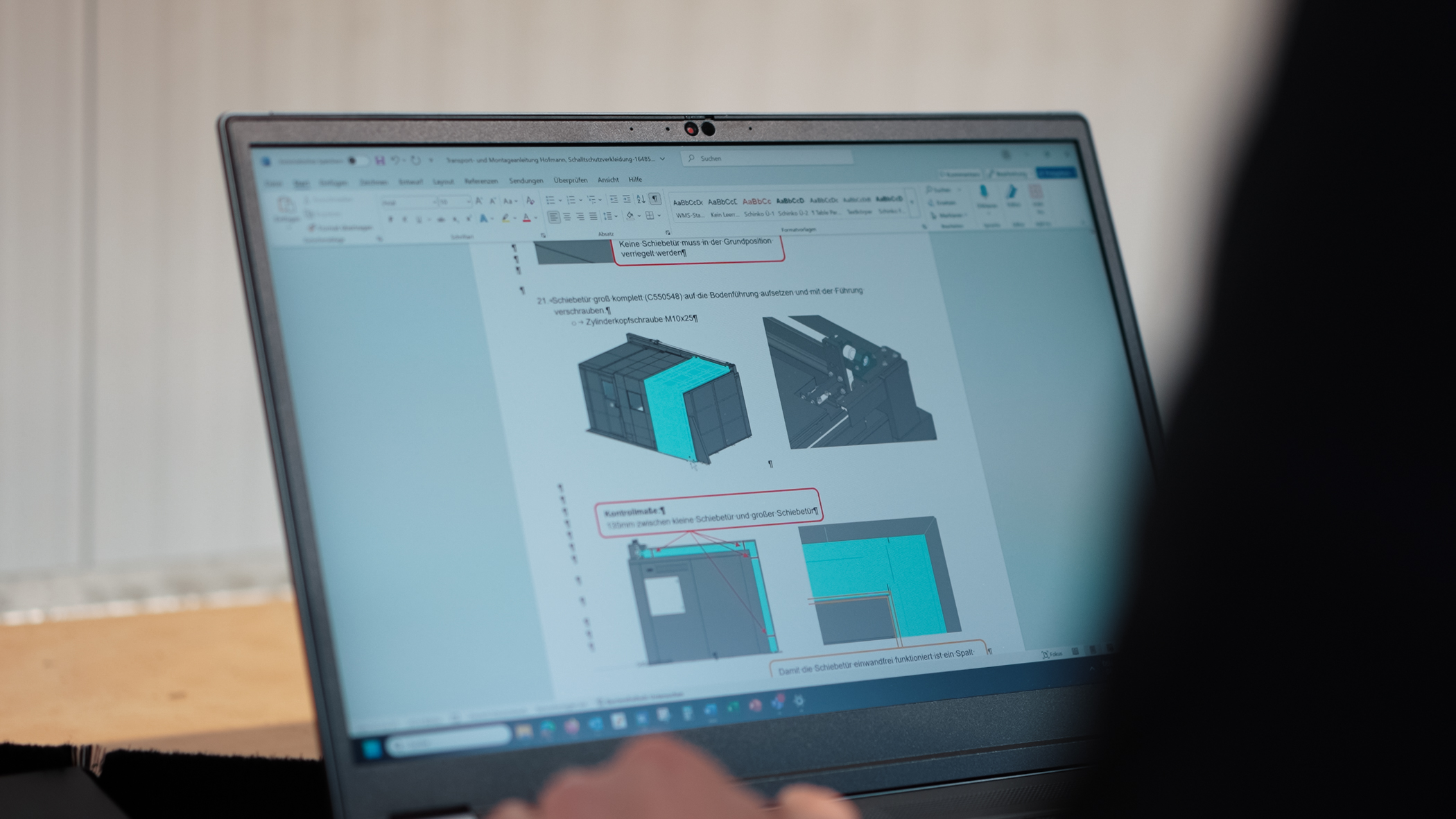 laptop screen displaying diagrams of a mechanical
